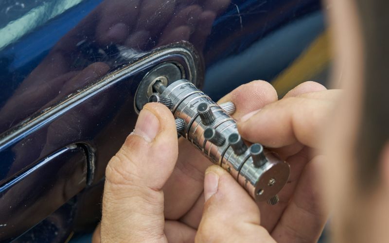 Technician using a professional tool to recover all lost car keys without damaging the vehicle in Leigh, UK